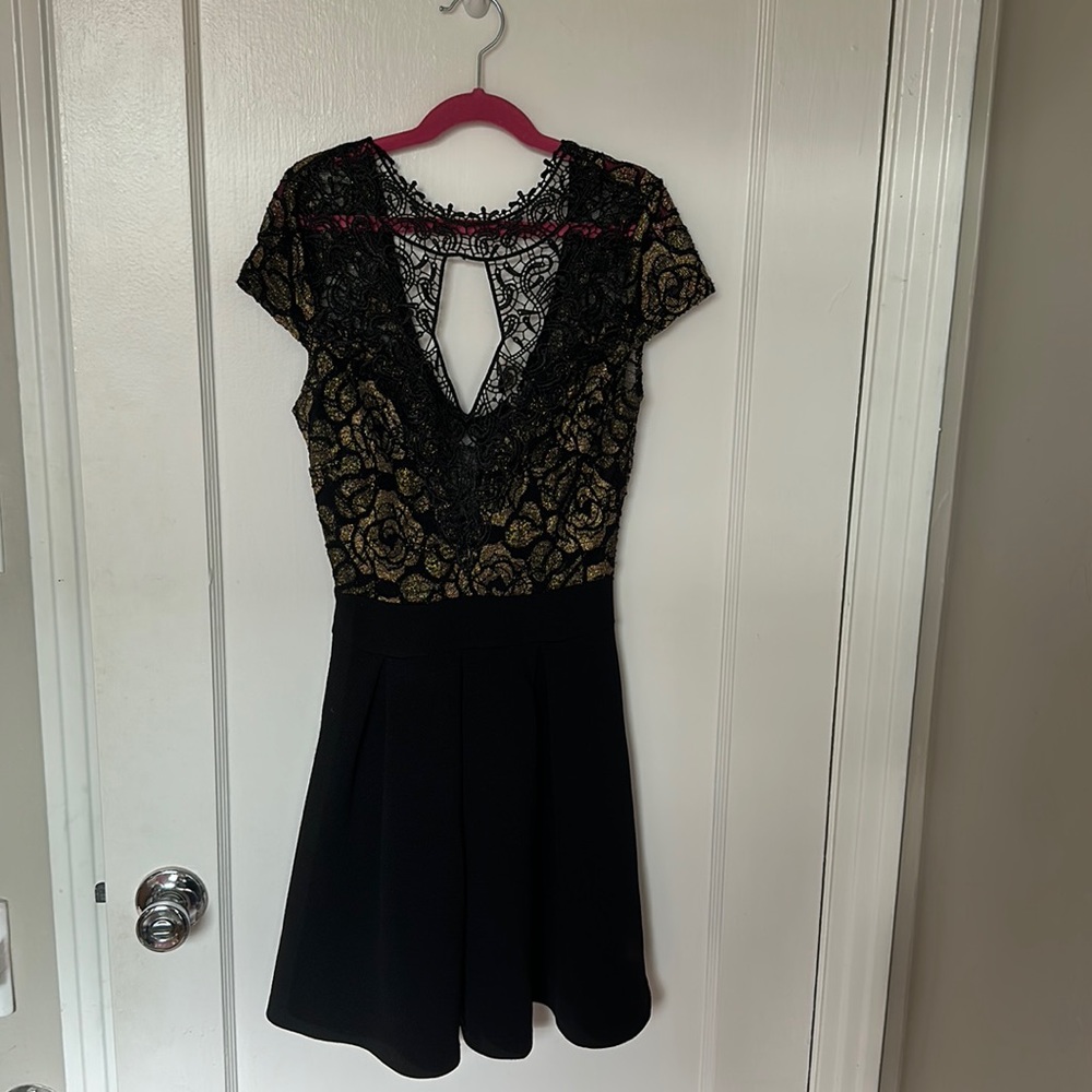 Black and gold metallic lace cocktail dress.